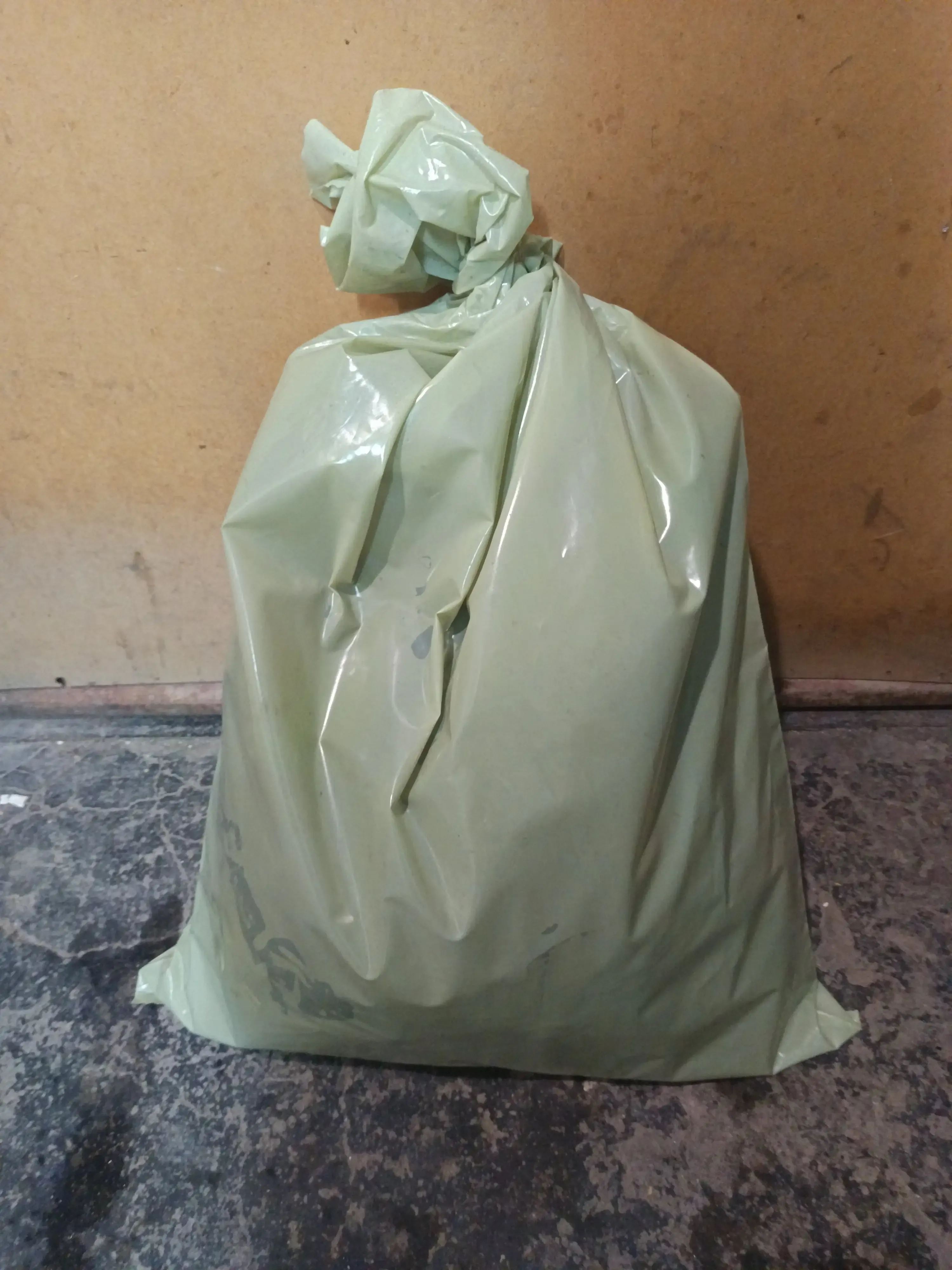 Backpack sealed inside the containment sack after spraying